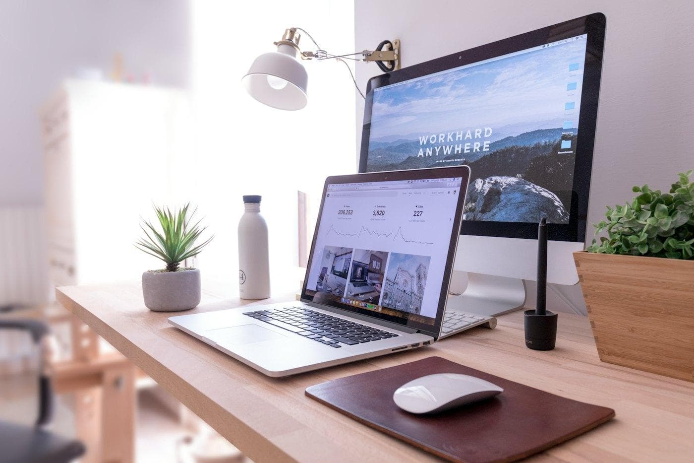A tidy desk with a laptop and monitor